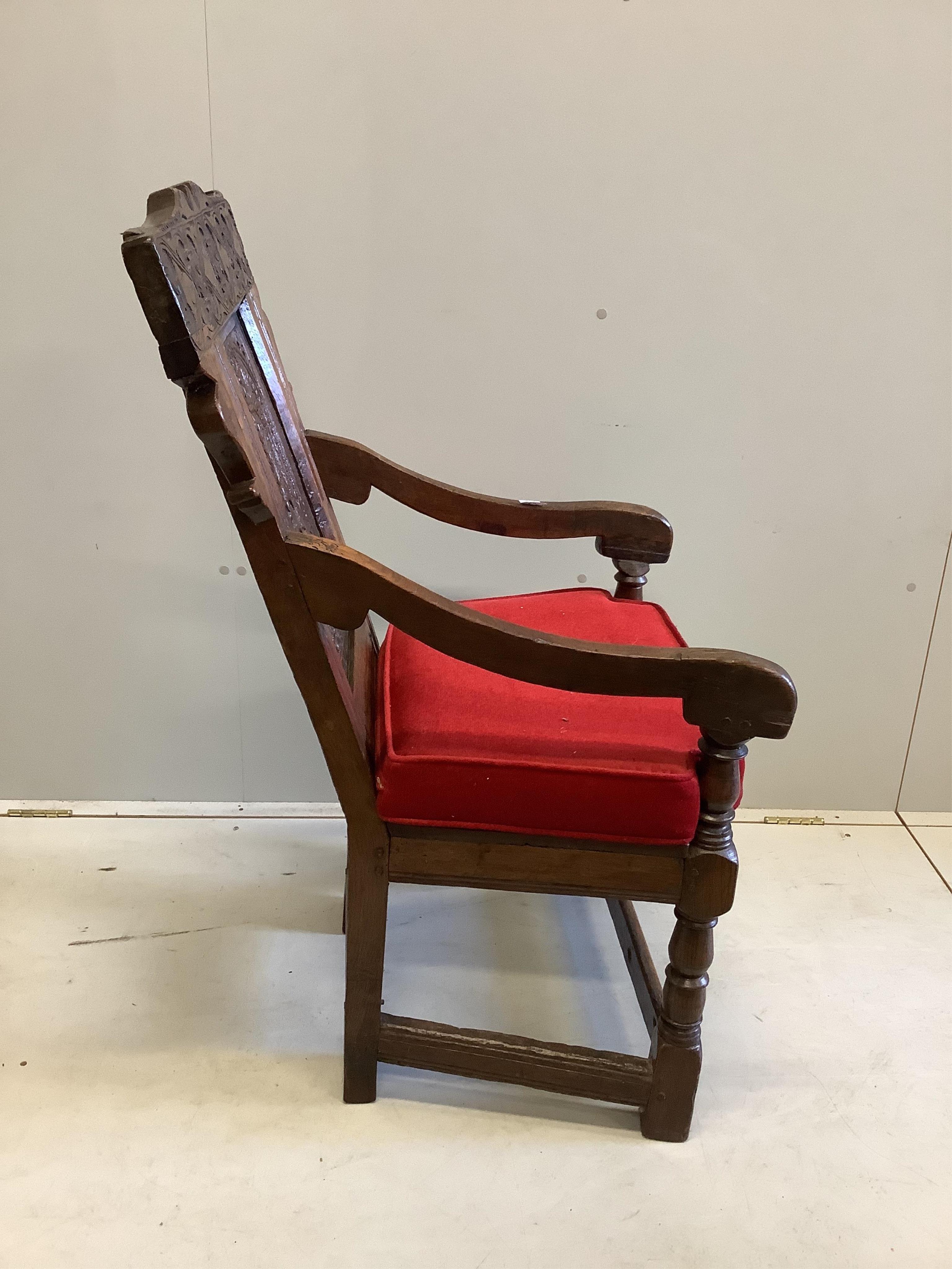 A 17th century carved oak wainscot elbow chair, width 57cm, depth 52cm, height 105cm. Condition - fair